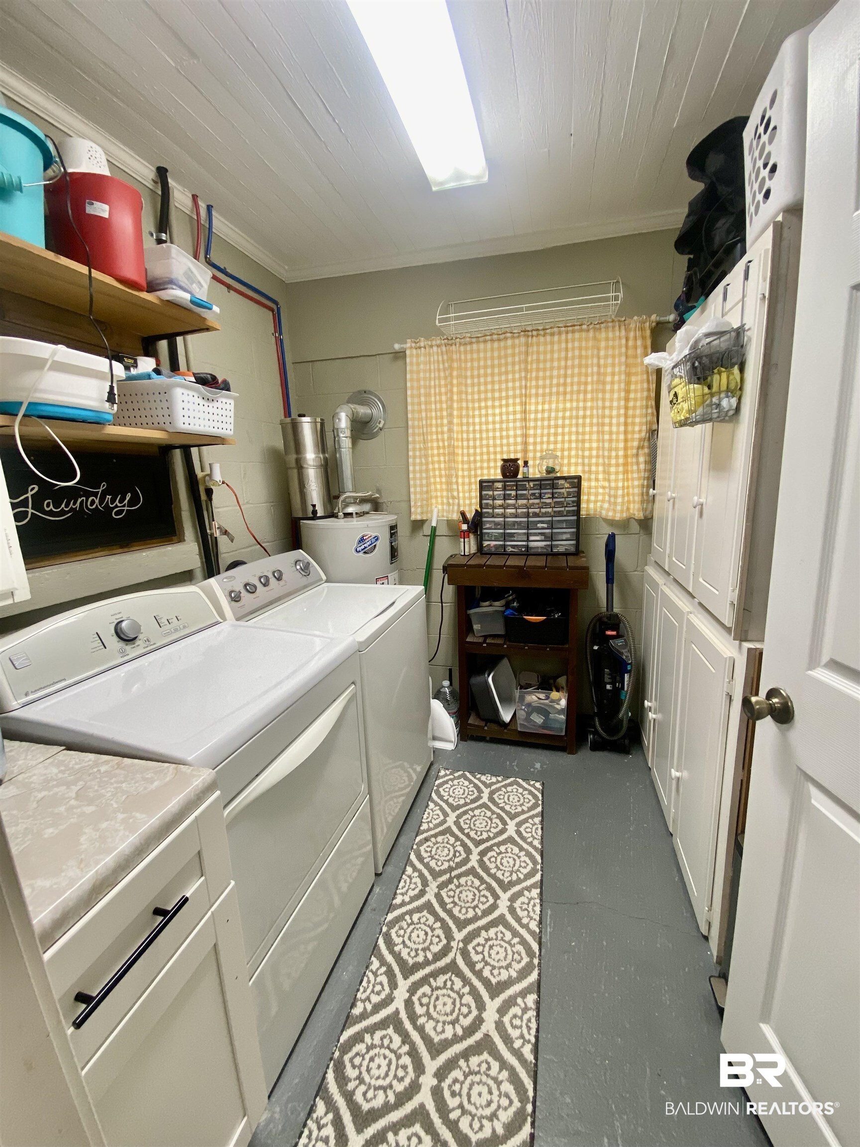531 Highway 136 Monroeville, AL 36460 - Photo 37 of 48 Washroom with washer and dryer, water heater, cabinets, and ornamental molding