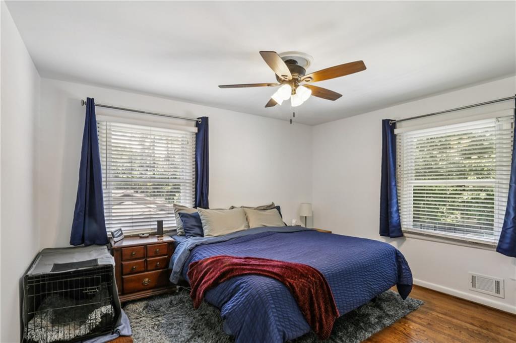 2740 Frontier Trail Atlanta, GA 30341 - Photo 22 of 29 a bedroom with a bed and a chandelier