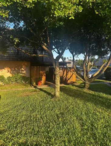 a backyard of a house with lots of green space