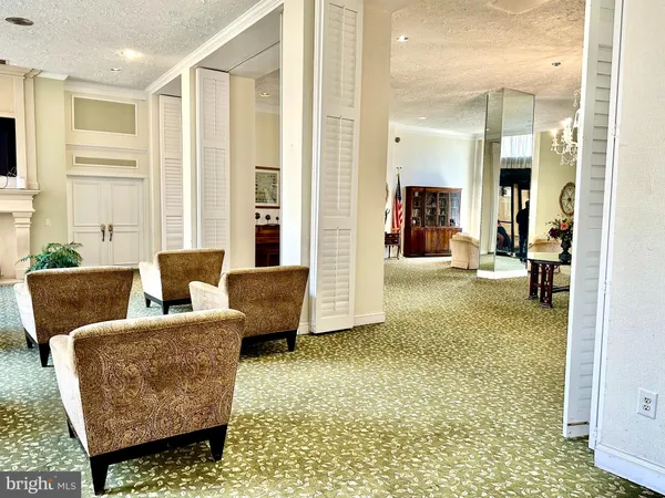a living room with furniture and a view of living room