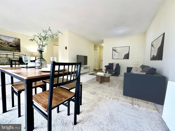 a living room with furniture and a table
