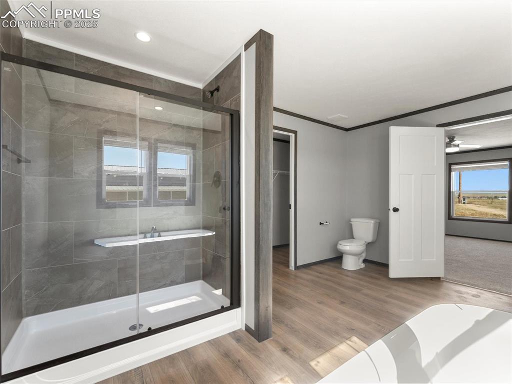 2690 East Ellicott Road South Calhan, CO 80808 - Photo 23 of 46 a spacious bathroom with a glass door shower