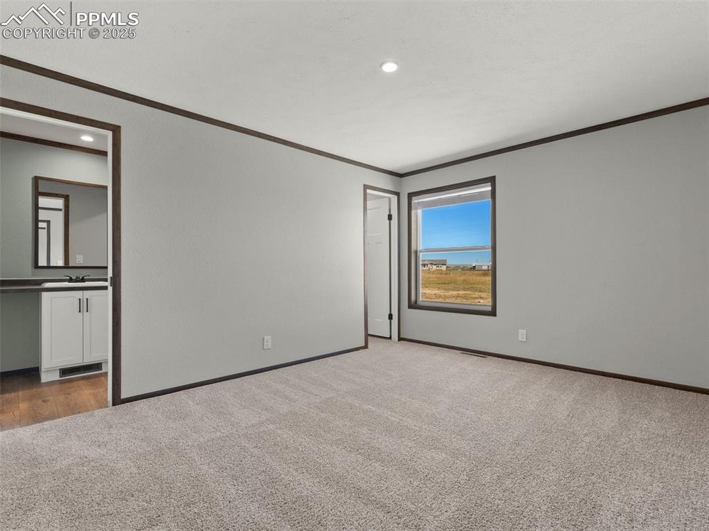 2690 East Ellicott Road South Calhan, CO 80808 - Photo 33 of 46 a view of an empty room with a window