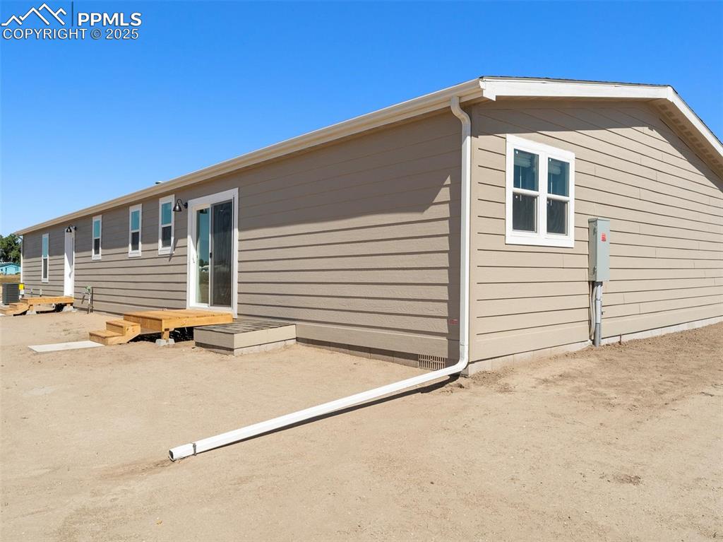 2690 East Ellicott Road South Calhan, CO 80808 - Photo 45 of 46 a view of a house with backyard