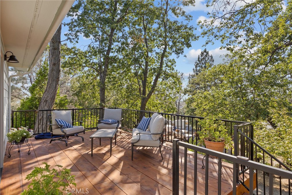4592 Wendlis Road Forest Ranch, CA 95942 - Photo 4 of 64 a view of a patio with a table and chairs with wooden fence