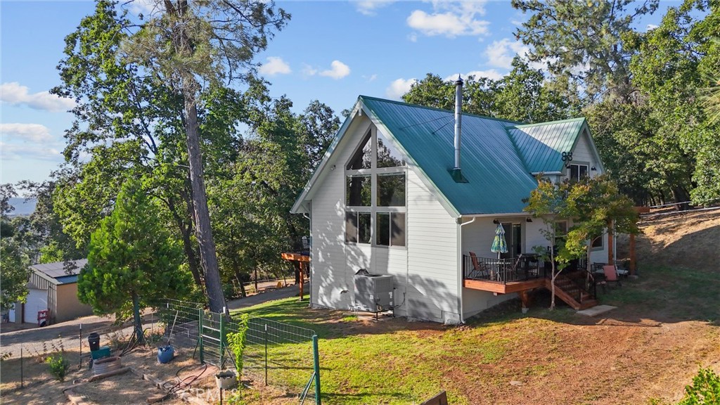 4592 Wendlis Road Forest Ranch, CA 95942 - Photo 46 of 64 a view of house with a yard and sitting area