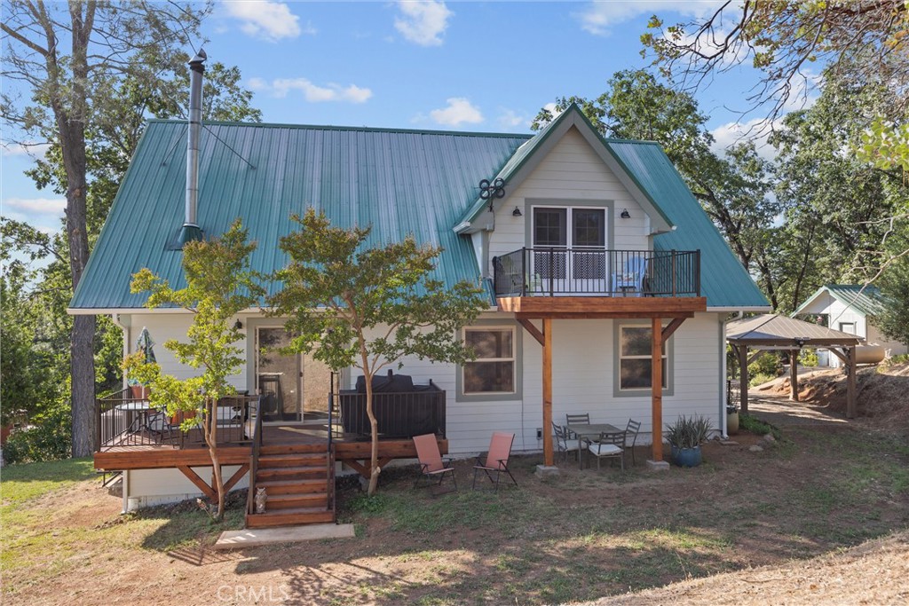 4592 Wendlis Road Forest Ranch, CA 95942 - Photo 5 of 64 a front view of a house with garden