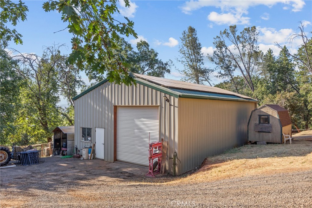 4592 Wendlis Road Forest Ranch, CA 95942 - Photo 52 of 64 a front view of a house with a garage
