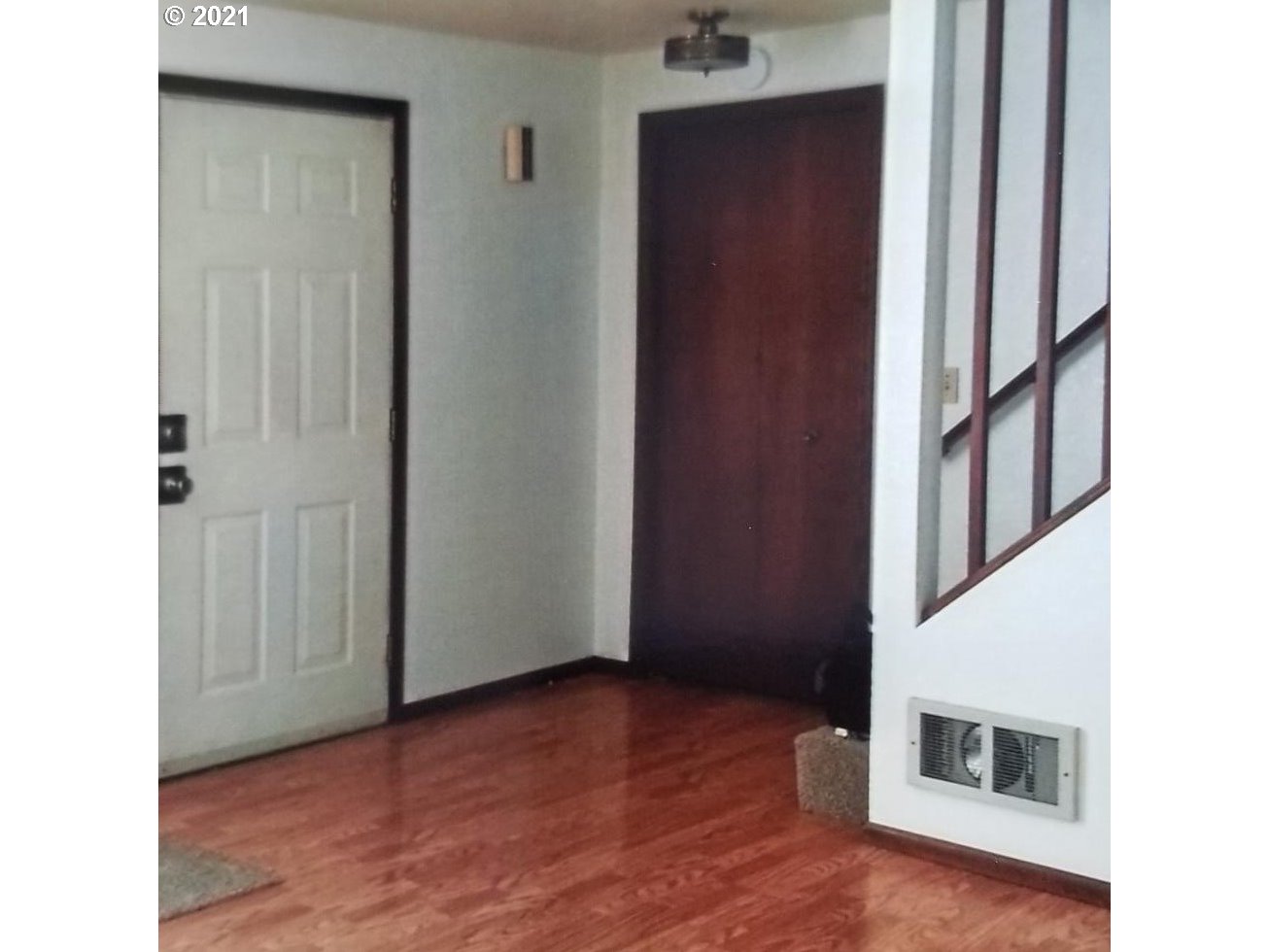830 Janus Street Springfield, OR 97477 - Photo 4 of 11 a view of a livingroom with wooden floor and staircase