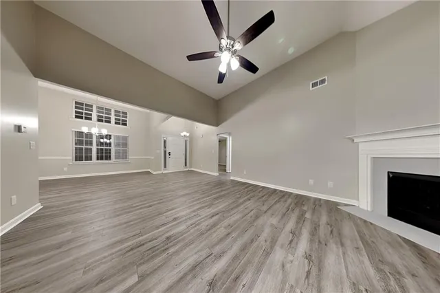 wooden floor in an empty room with a fireplace