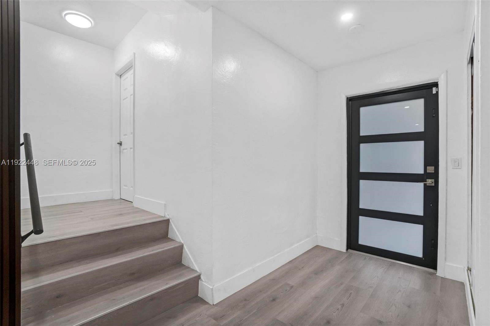 14431 Northwest 13th Road Miami, FL 33167 - Photo 13 of 39 a view of entryway with wooden floor