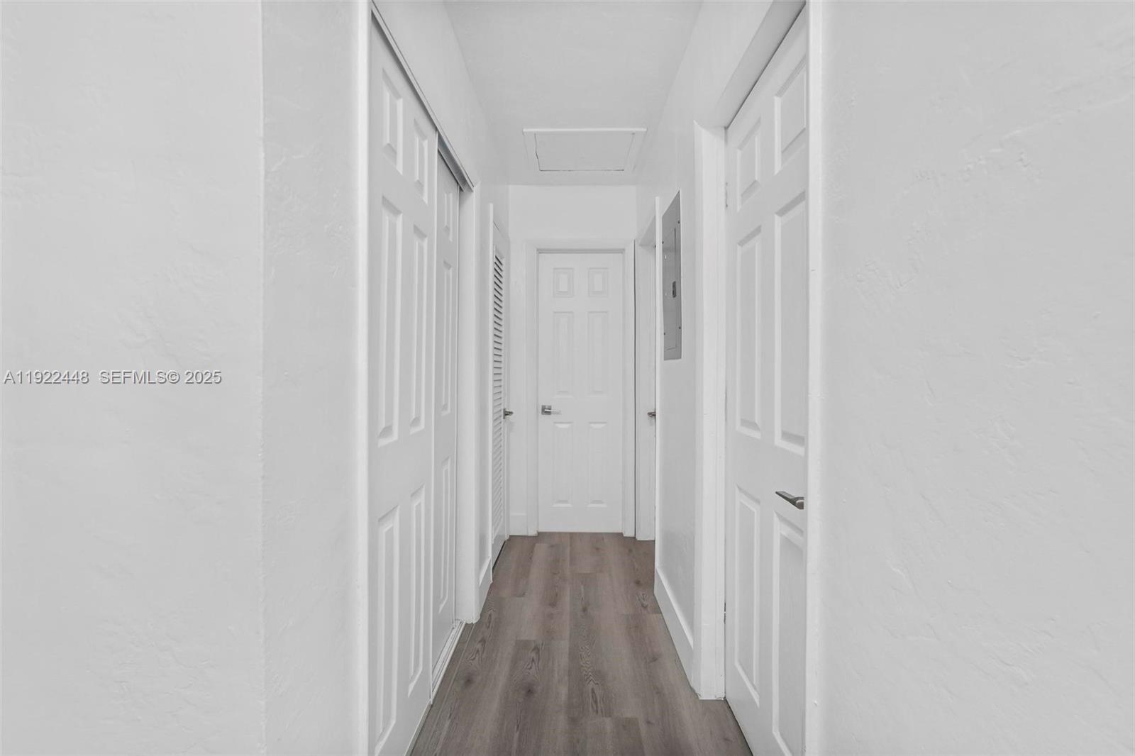 14431 Northwest 13th Road Miami, FL 33167 - Photo 14 of 39 a view of a hallway with wooden floor and entryway