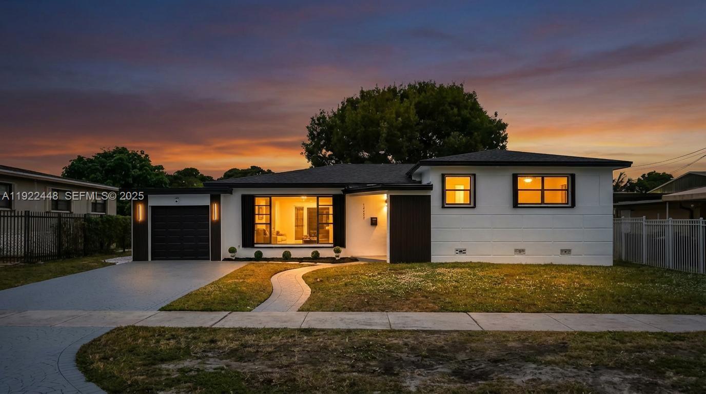 14431 Northwest 13th Road Miami, FL 33167 - Photo 2 of 39 a view of a house with a yard