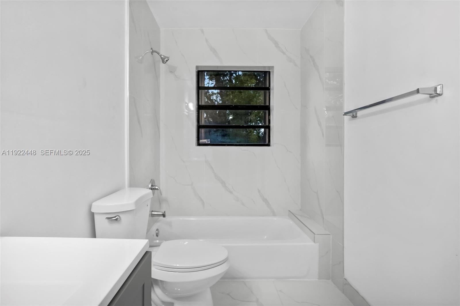 14431 Northwest 13th Road Miami, FL 33167 - Photo 26 of 39 a bathroom with a toilet a sink and bathtub