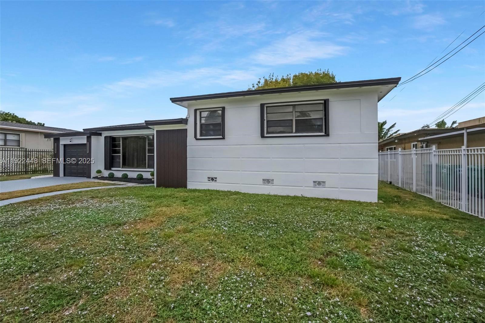 14431 Northwest 13th Road Miami, FL 33167 - Photo 32 of 39 a house with garden in front of it