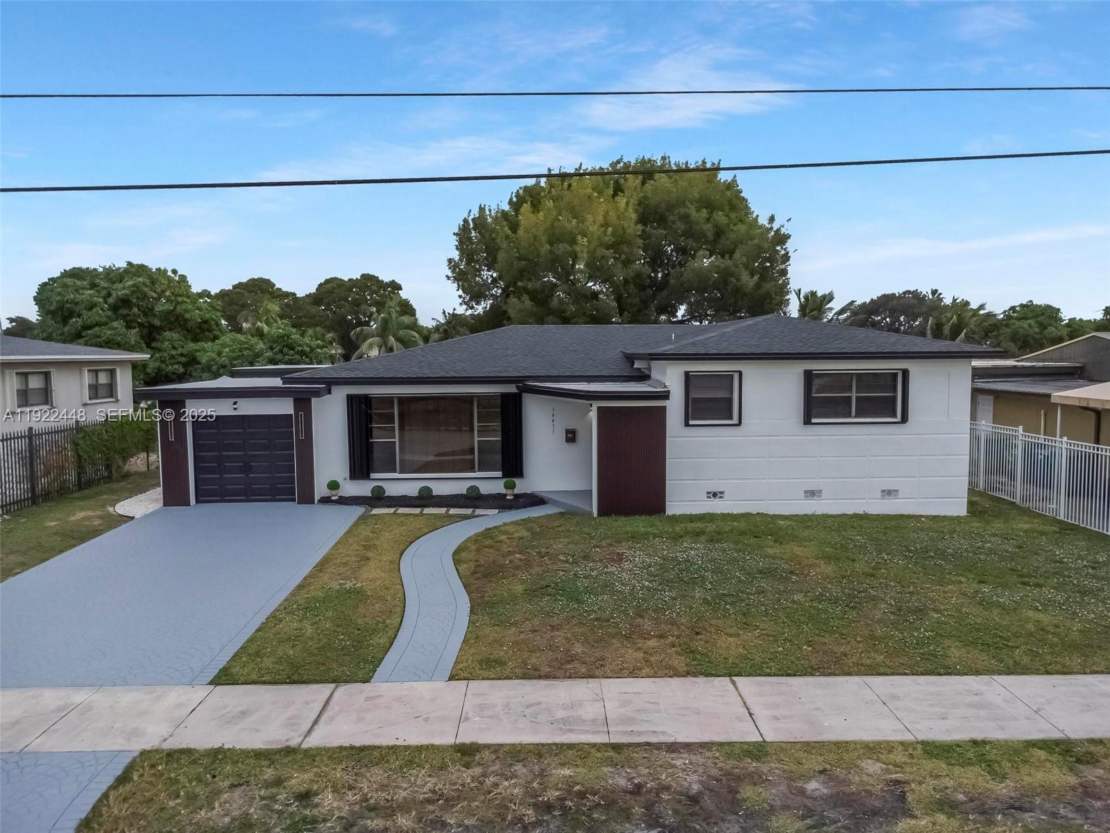 14431 Northwest 13th Road Miami, FL 33167 - Photo 33 of 39 a view of a house with a patio