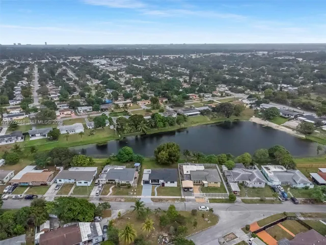 an aerial view of a city with lake view
