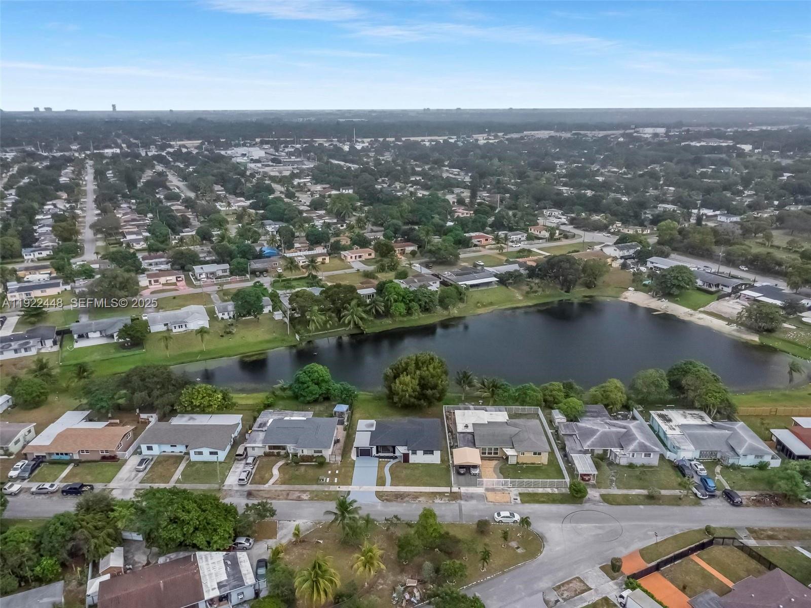 14431 Northwest 13th Road Miami, FL 33167 - Photo 36 of 39 an aerial view of a city with lake view