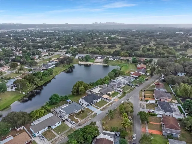 an aerial view of a city with lake view