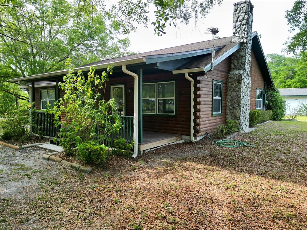 33515 Chancey Road Zephyrhills, FL 33543 - Photo 1 of 1 Southeast front exposure Log Home