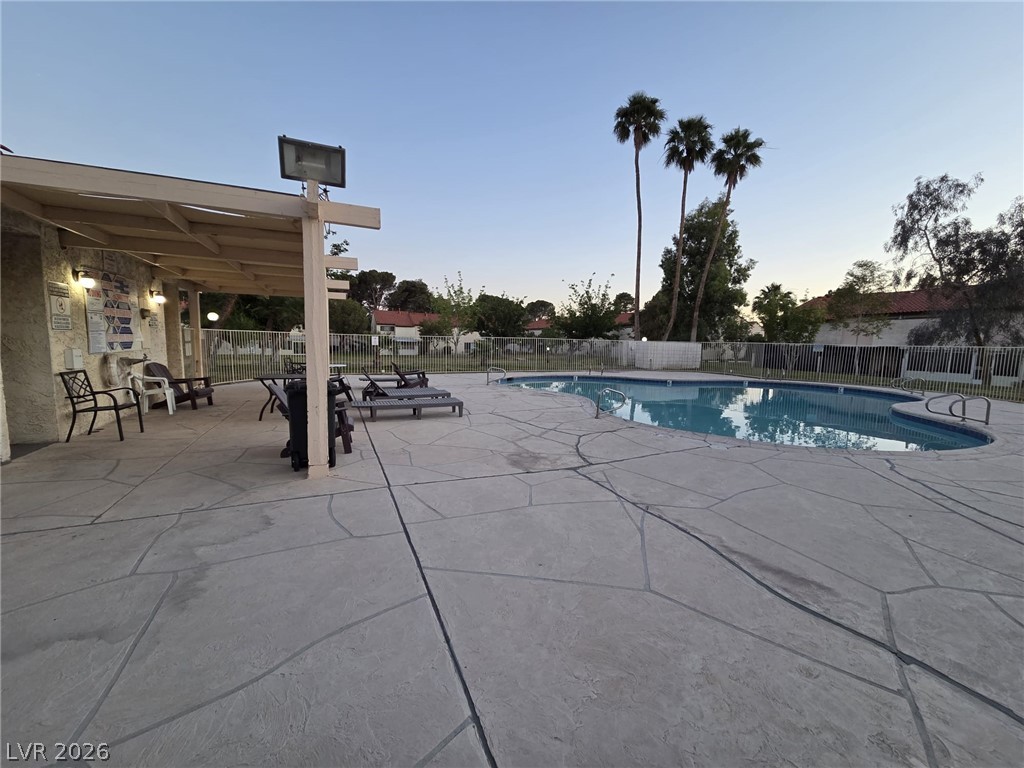 3317 Racquet Street Las Vegas, NV 89121 - Photo 19 of 23 Relax poolside at this inviting outdoor space, perfect for leisure.