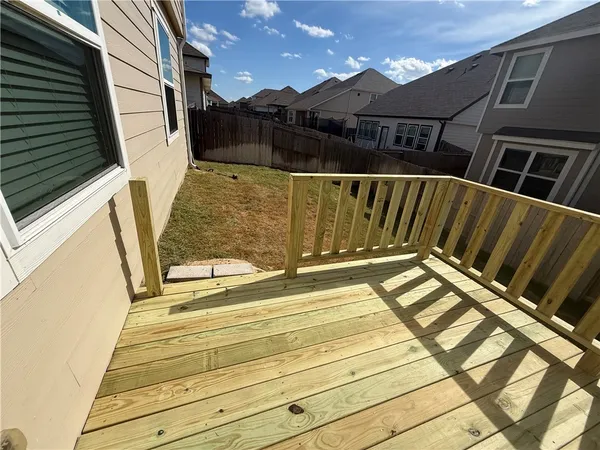 a view of deck with wooden floor and fence