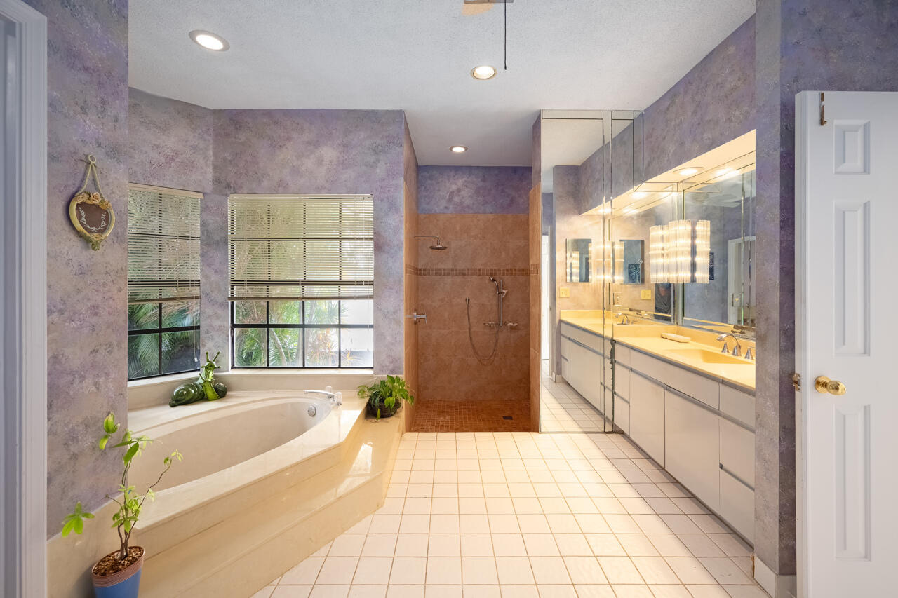 3740 Canterbury Way Boca Raton, FL 33434 - Photo 26 of 55 a spacious bathroom with a granite countertop tub shower and sink