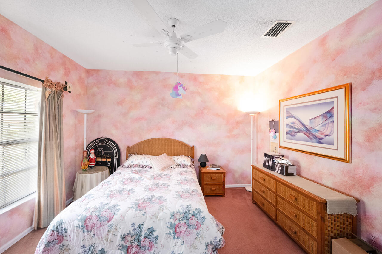 3740 Canterbury Way Boca Raton, FL 33434 - Photo 35 of 55 a bedroom with furniture and a mirror