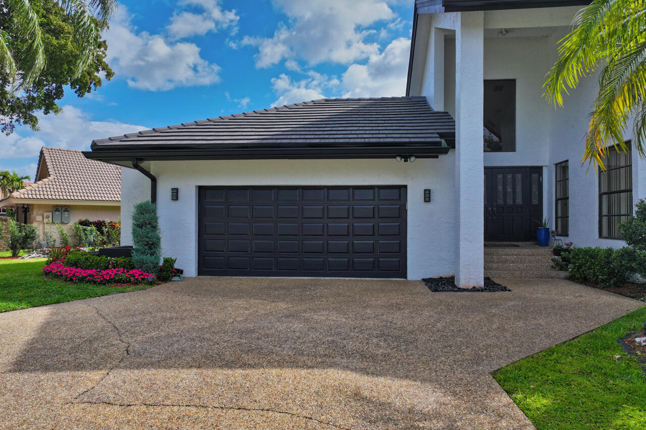 3740 Canterbury Way Boca Raton, FL 33434 - Photo 52 of 55 a front view of a house