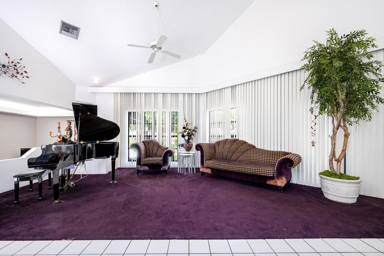 3740 Canterbury Way Boca Raton, FL 33434 - Photo 8 of 55 a living room with furniture and a potted plant