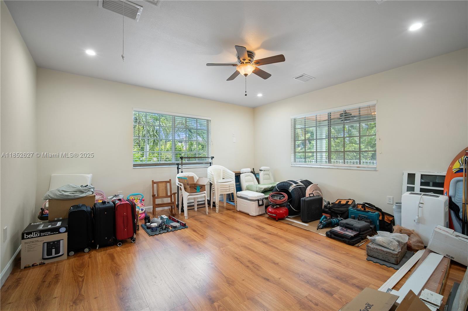29001 Southwest 157th Avenue Homestead, FL 33033 - Photo 11 of 23 a living room with furniture window and wooden floor