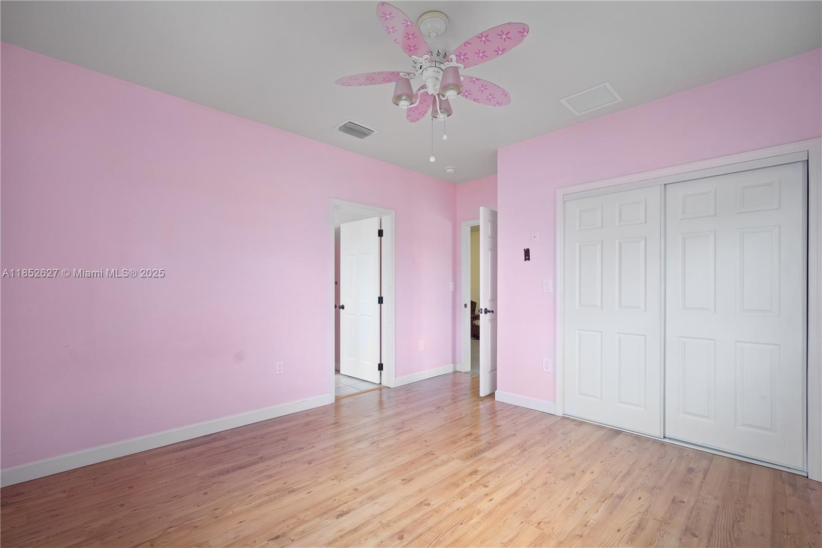 29001 Southwest 157th Avenue Homestead, FL 33033 - Photo 15 of 23 a view of an empty room with wooden floor