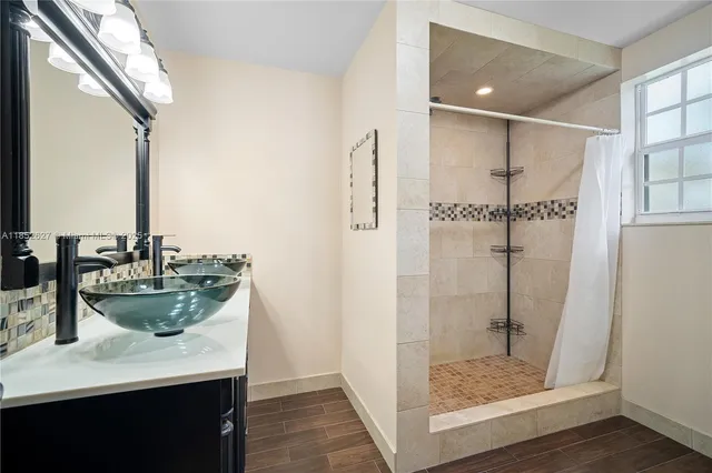 a kitchen with a sink and a refrigerator