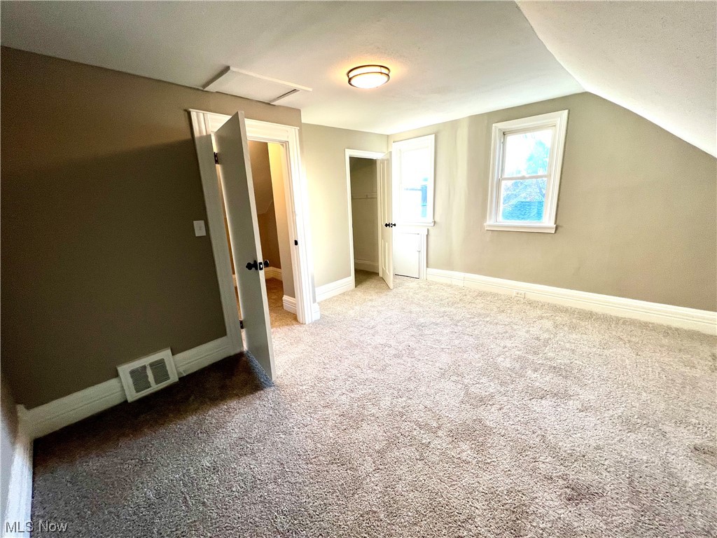 3527 Broadview Road Cleveland, OH 44109 - Photo 19 of 29 Additional living space with lofted ceiling and light carpet