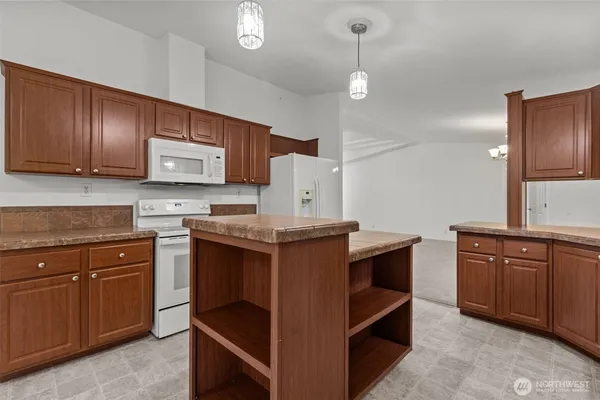 a kitchen with wooden cabinets and a sink