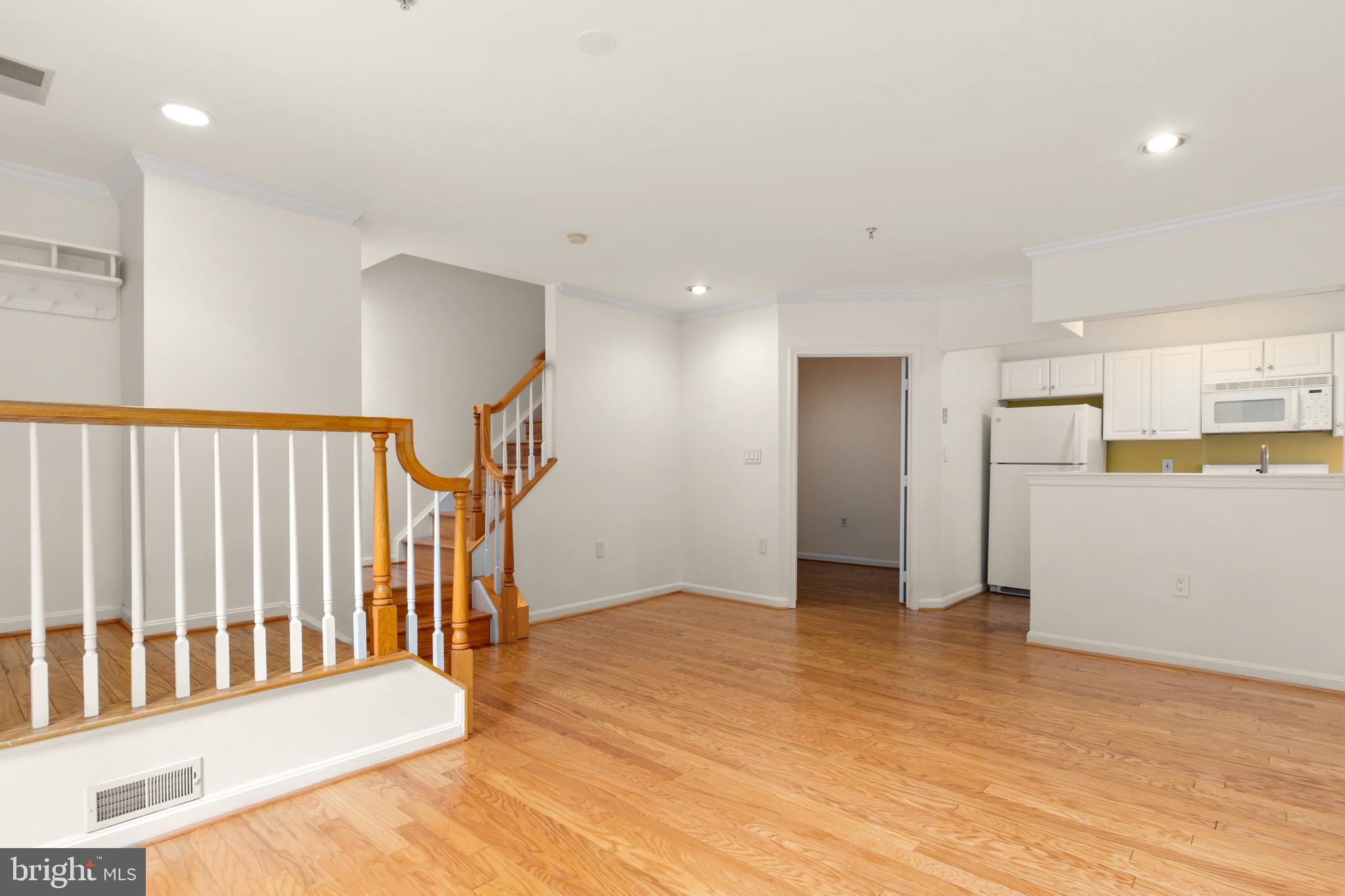 1911 Belmont Road Northwest, Unit 71 Washington, DC 20009 - Photo 5 of 22 Open kitchen, dining space, and den