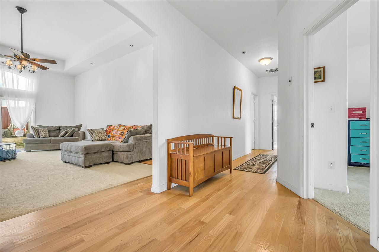 1356 Saddle Ridge Road Loma, CO 81524 - Photo 12 of 37 a living room with furniture and a wooden floor