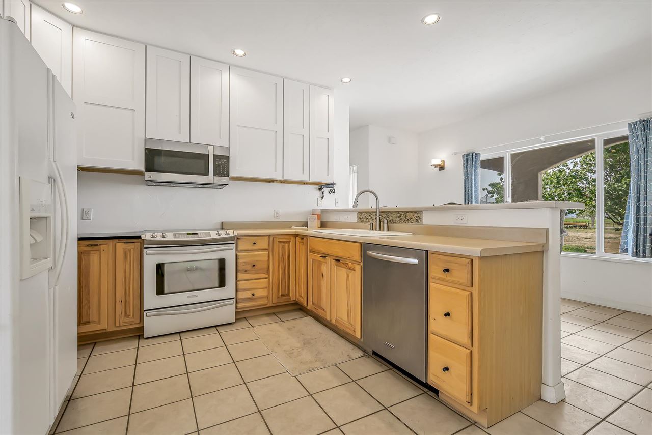 1356 Saddle Ridge Road Loma, CO 81524 - Photo 15 of 37 a kitchen with a stove sink and cabinets