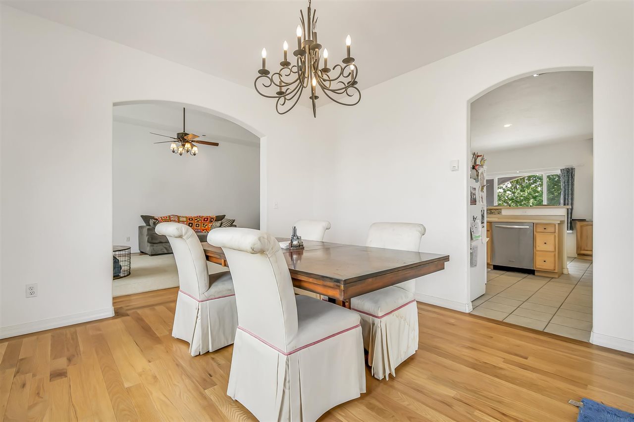 1356 Saddle Ridge Road Loma, CO 81524 - Photo 16 of 37 a view of a dining room with furniture and wooden floor