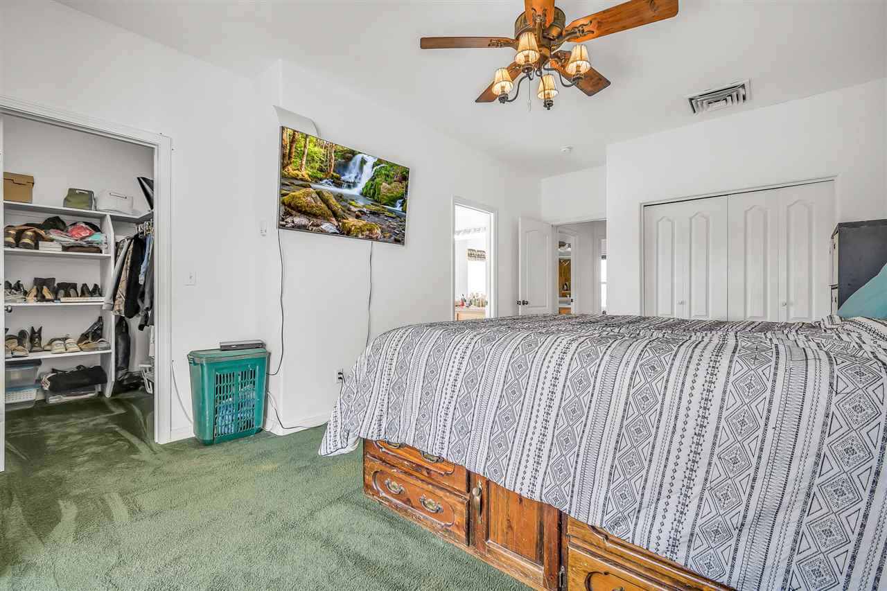 1356 Saddle Ridge Road Loma, CO 81524 - Photo 17 of 37 a bedroom with furniture and a window
