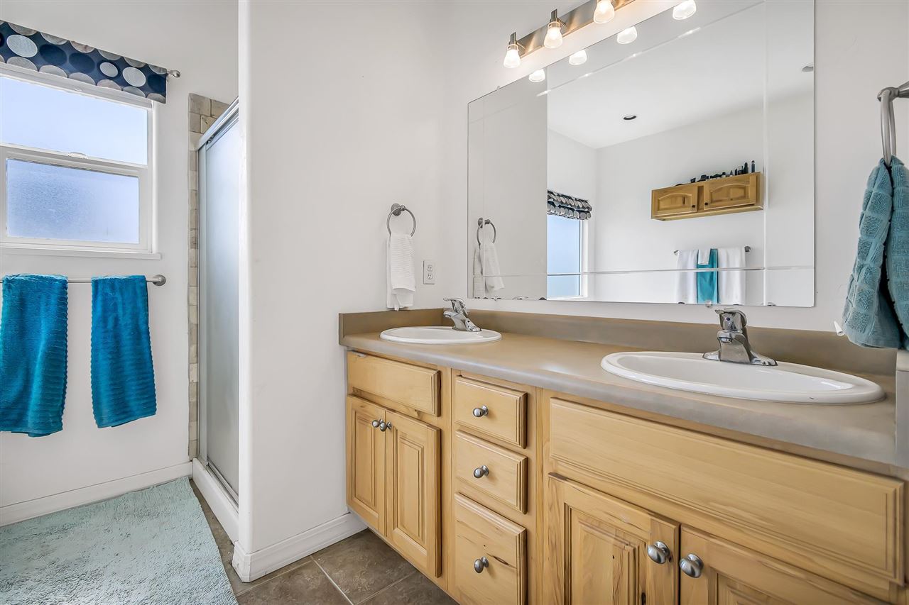 1356 Saddle Ridge Road Loma, CO 81524 - Photo 19 of 37 a bathroom with a double vanity sink and a mirror