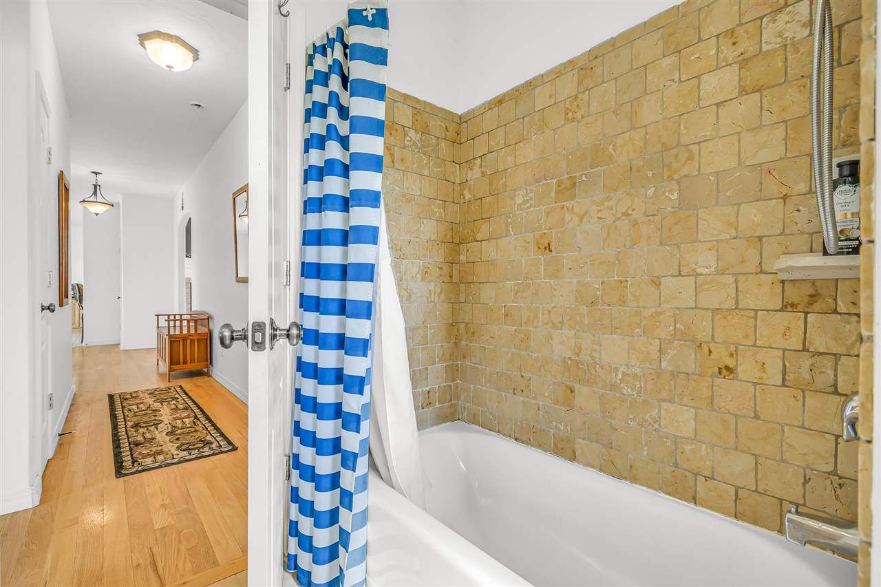 1356 Saddle Ridge Road Loma, CO 81524 - Photo 23 of 37 a bathroom with a bathtub and shower