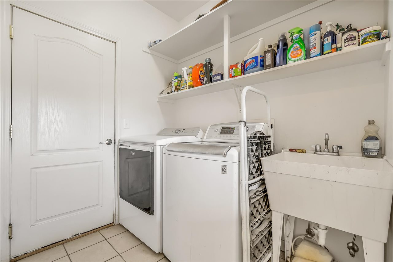 1356 Saddle Ridge Road Loma, CO 81524 - Photo 25 of 37 a utility room with dryer and washer