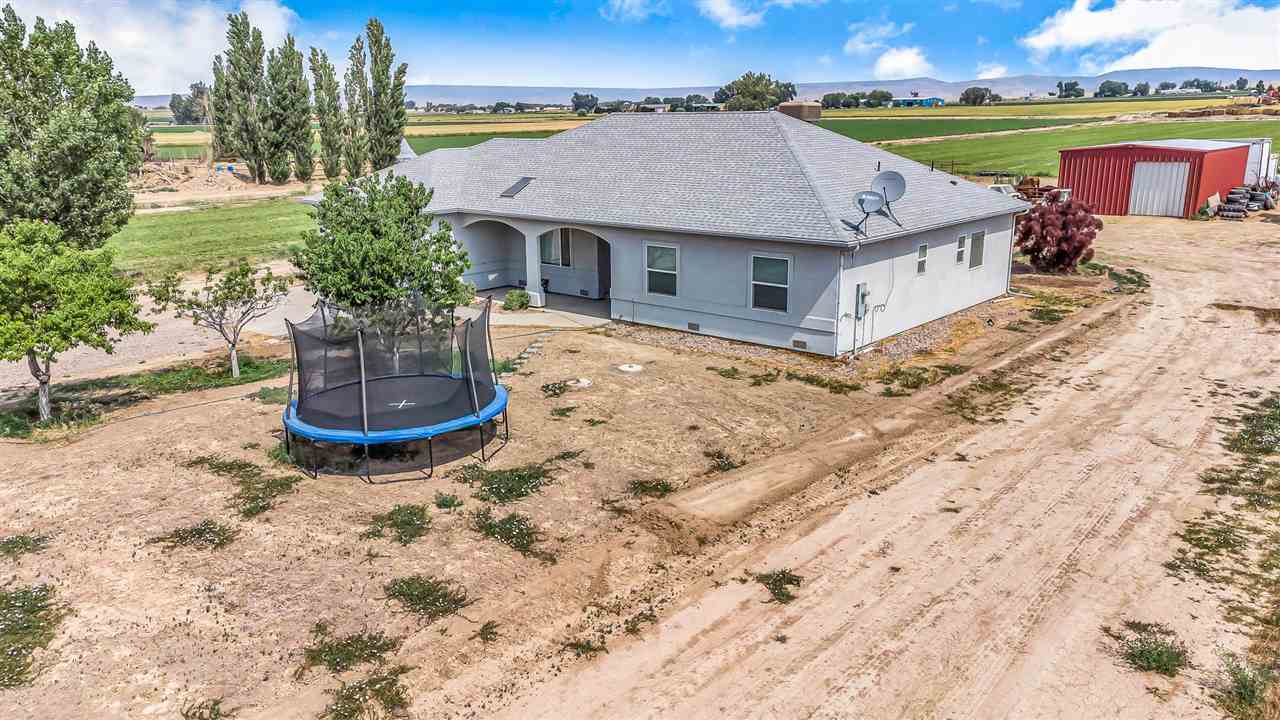 1356 Saddle Ridge Road Loma, CO 81524 - Photo 29 of 37 a aerial view of a house with a yard and a fountain