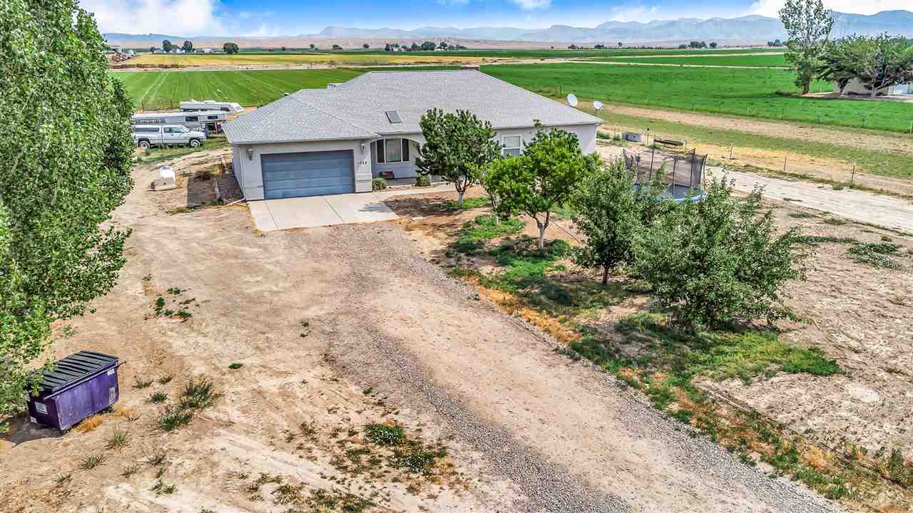 1356 Saddle Ridge Road Loma, CO 81524 - Photo 33 of 37 a view of a yard with an outdoor space