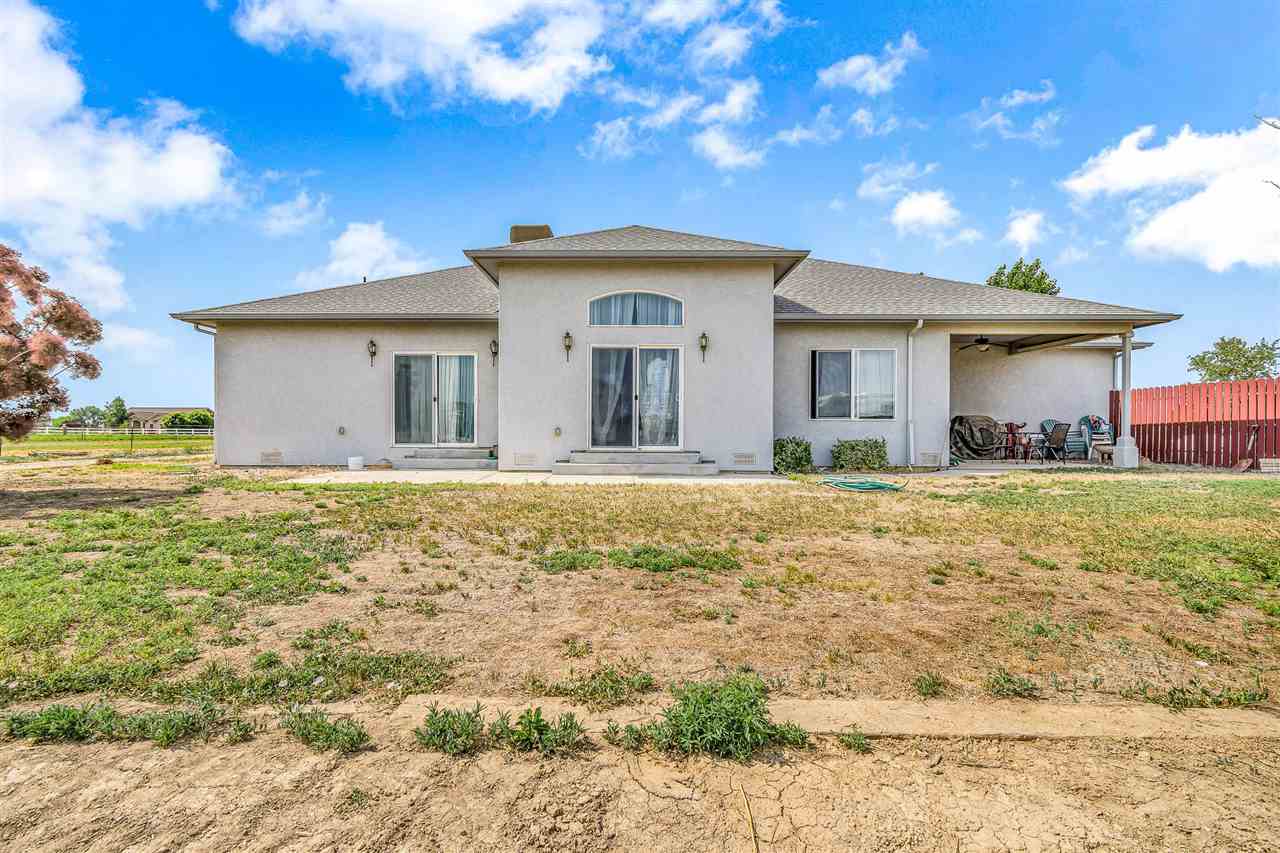 1356 Saddle Ridge Road Loma, CO 81524 - Photo 36 of 37 a front view of a house with garden