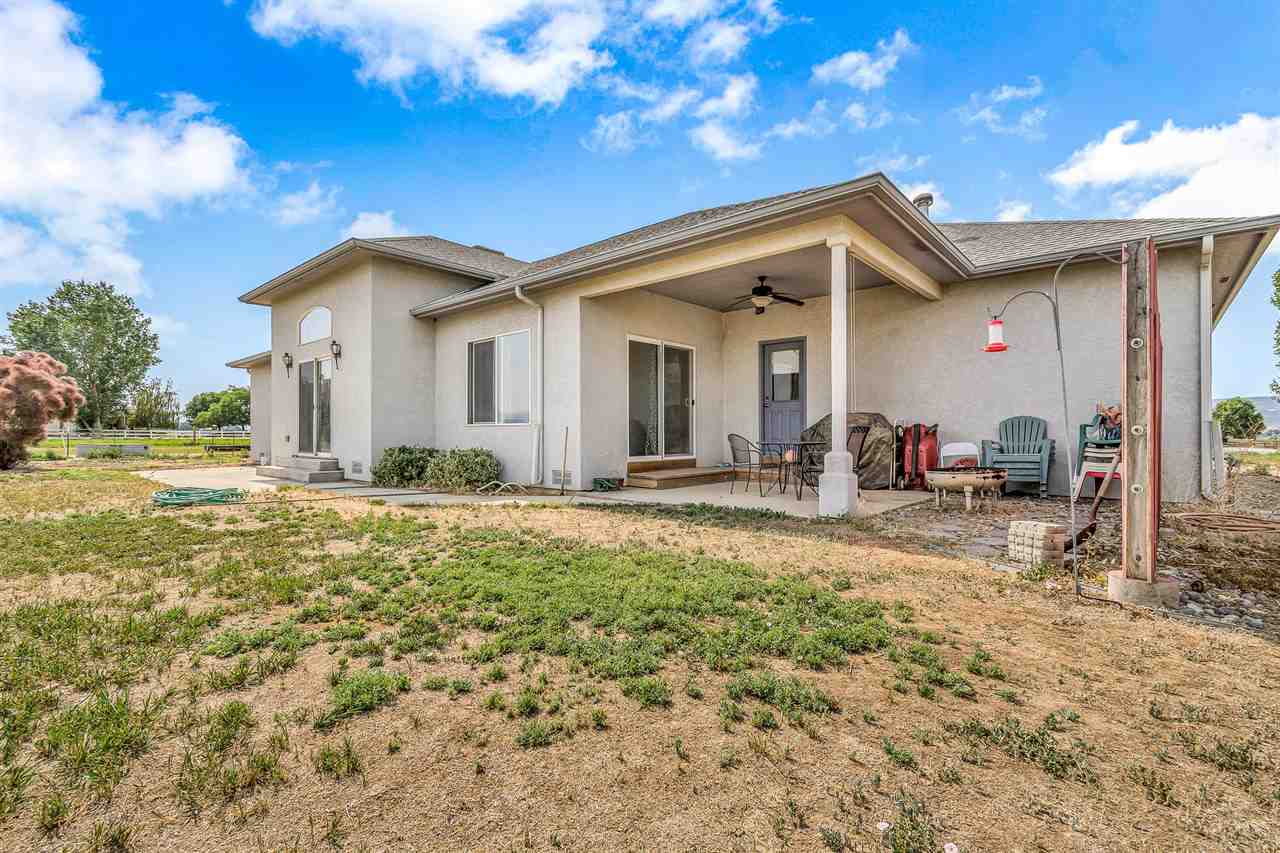 1356 Saddle Ridge Road Loma, CO 81524 - Photo 4 of 37 a view of a house with a yard