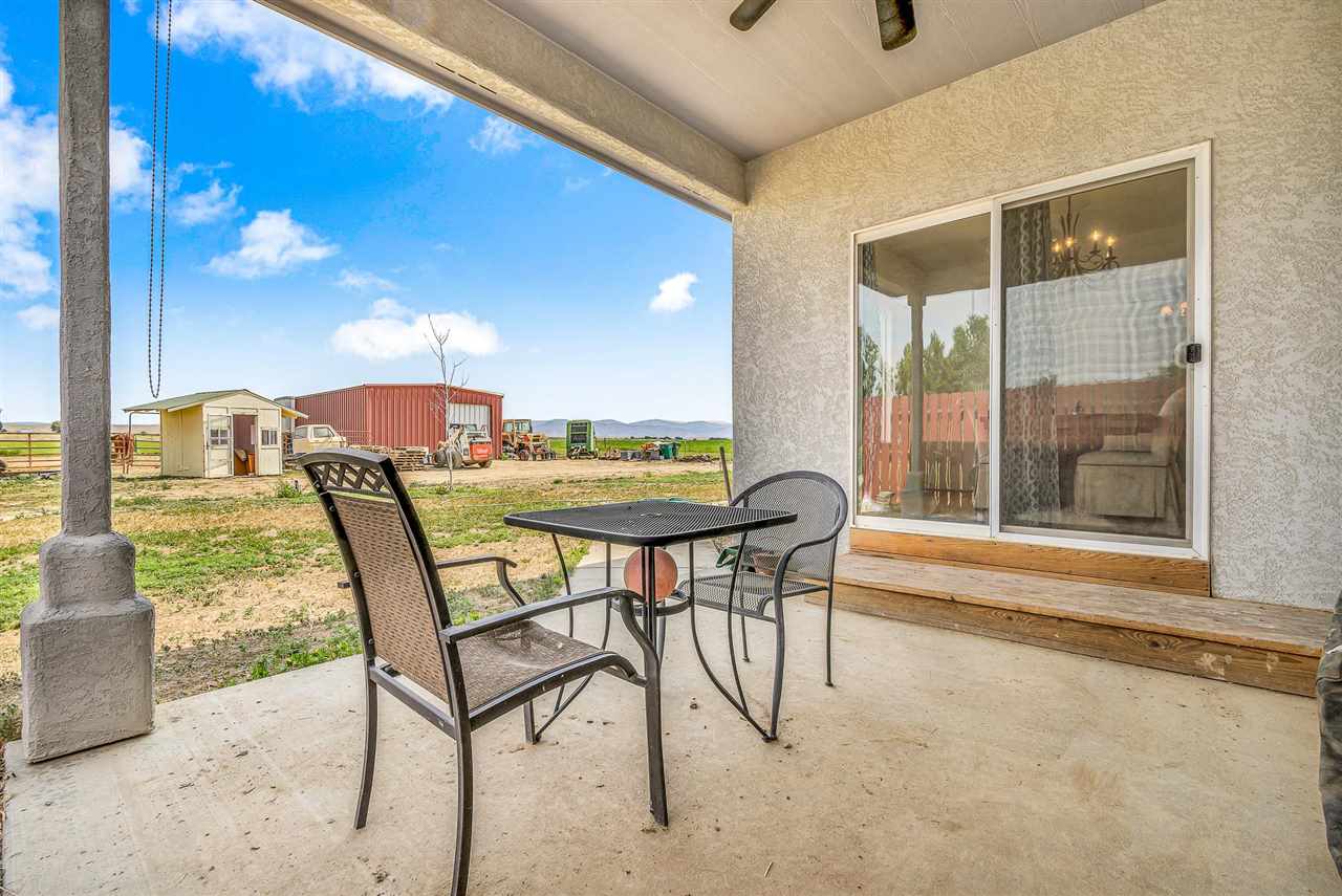1356 Saddle Ridge Road Loma, CO 81524 - Photo 6 of 37 a view of a dining room with furniture and a window