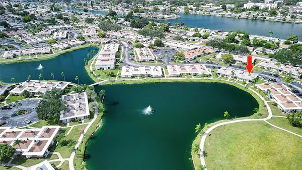 an aerial view of a house with a lake view