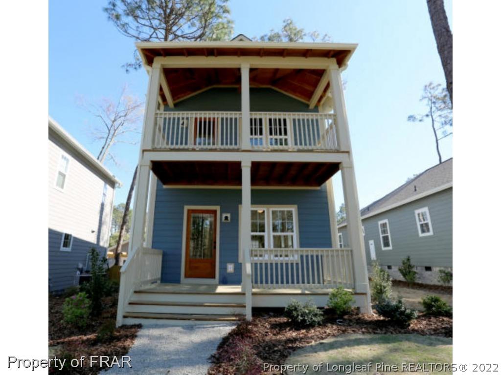 229 Springwood Way Southern Pines, NC 28387 - Photo 1 of 4 front view of a house with a small yard